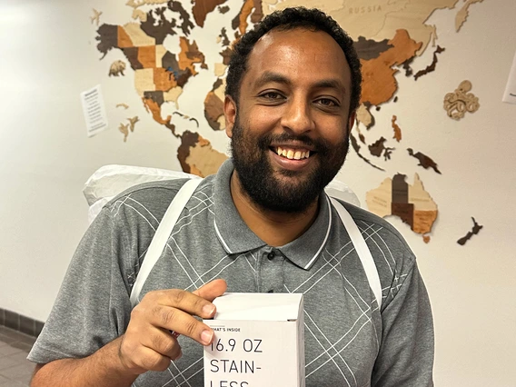 person holding prize