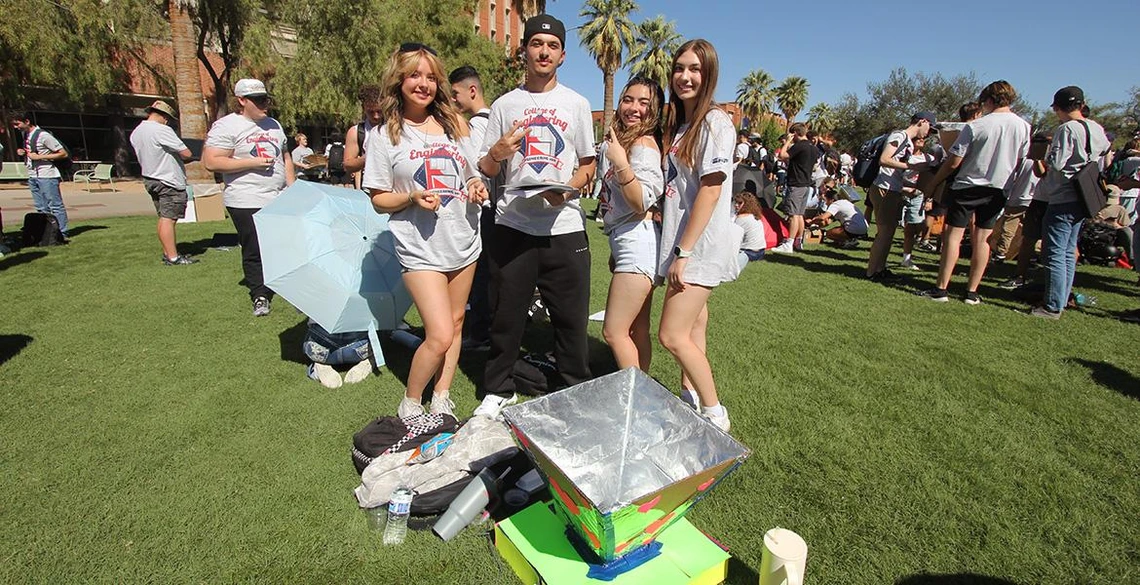 Students show off their projects at the University of Arizona College of Engineering's Solar Oven Throw Down.