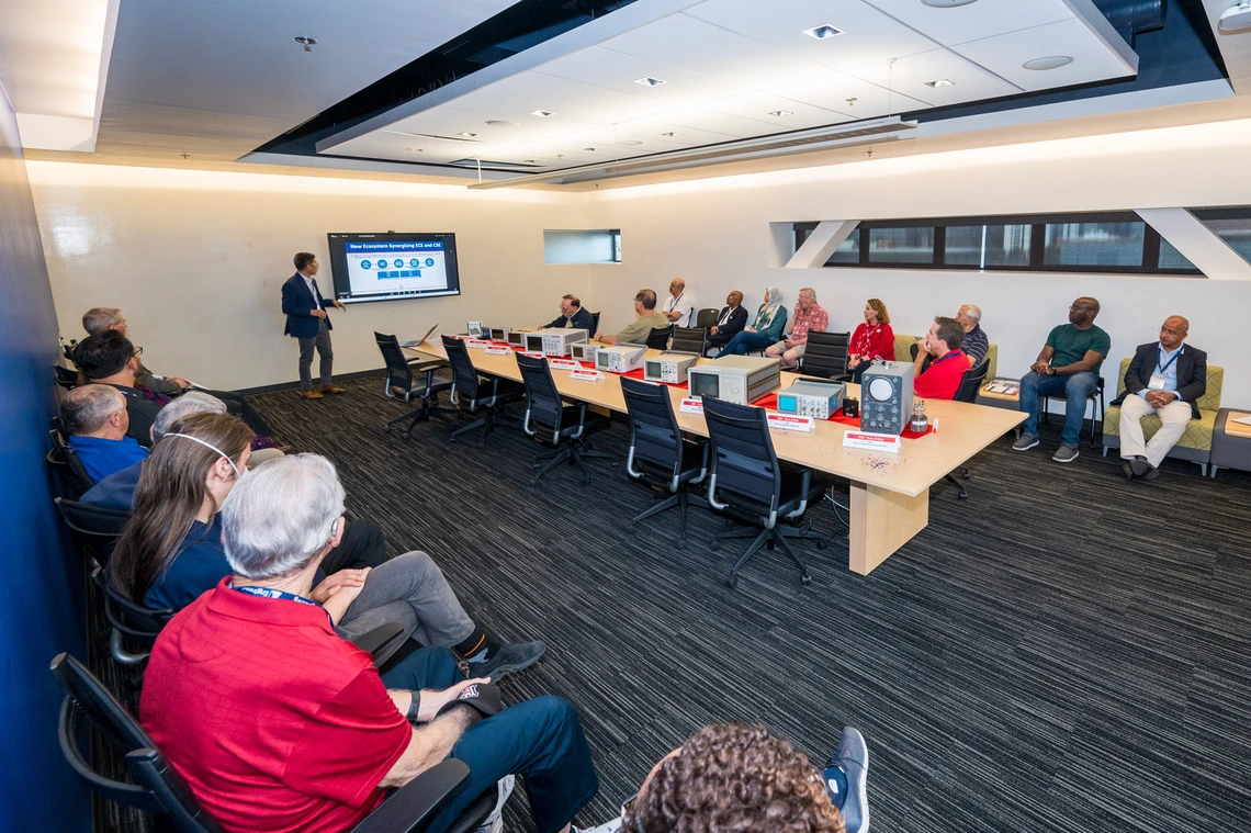 people seated at conference room table