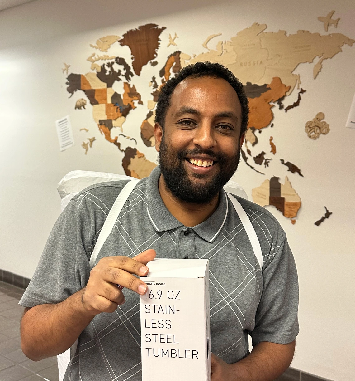 person holding prize